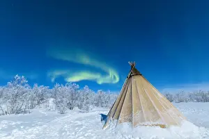 Tent Prints: Isolated Sami tent in the snow under Northern Lights (Aurora Borealis)
