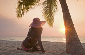 Sun Beam Prints: Jamaican woman on beach at sunset
