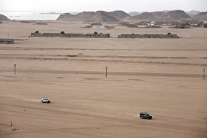 Sudan Prints: Jeeps cover the wide expanse of desert between Lake