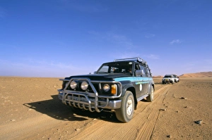 Dirt Track Prints: Jeeps driving through desert, Erg Murzuq, Sahara desert, Fezzan, Libya
