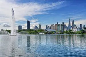 Titiwangsa Prints: Jet d?eau in Titiwangsa Lake Garden and Kuala Lumpur city skyline, Malaysia, Asia