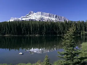Rockie Prints: Johnson Lake with snowy peak of Mount Rundle reflected in the water, Banff National Park