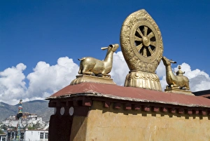 Jokhang Temple, the most revered religious structure in Tibet, with Potala Palace in the distance