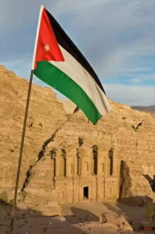 Images Dated 4th November 2009: The Jordanian flag in front of Al Deir (the Monastery) at sunset, Petra