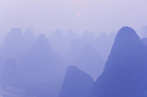 Enigma Prints: Karst landscape, haze and rising sun, Yangshuo, Guangxi Province, China, Asia
