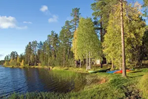 Finland Prints: Kayaks by the shore of a lake in Sodankyla during the autumn season in Finland