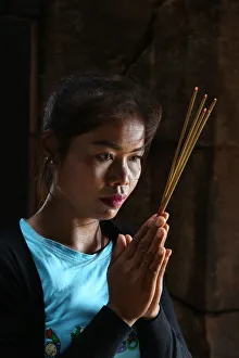 Indigenous Culture Prints: Khmer woman praying in a temple, Cambodia, Indochina, Southeast Asia, Asia