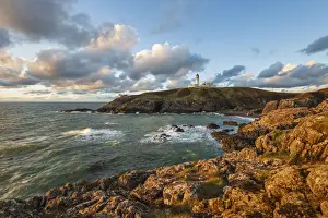 Portpatrick Prints: Killantringan Lighthouse on Black Head and rocky coastline at sunset