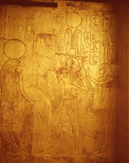 Detail of the king wearing Osiris crown with gods Reherakte and Maat on shrine of Tutankhamun Detail of the king wearing Osiris crown with gods Reherakte and Maat on shrine of Tutankhamun