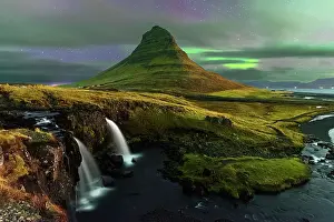 Purity Prints: Kirkjufell mountain and Kirkjufellfoss waterfall with faded Northern Lights (Aurora Borealis) behind clouds