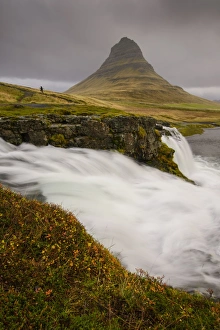 Kirkjufellsfoss Prints: Kirkjufellsfoss in autumn with hiker to show scale, Iceland, Polar Regions