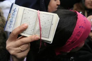 Books Prints: Koran being held during a Muslim demonstration, Paris, France, Europe