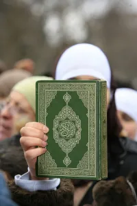 Books Prints: Koran being held during a Muslim demonstration, Paris, France, Europe