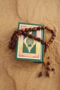 Books Prints: Koran and prayer beads in sand, Dubai, United Arab Emirates, Middle East