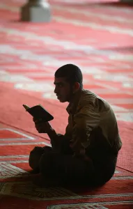 Young Man Prints: Koran reading at Al Azhar mosque, Cairo, Egypt, North Africa, Africa