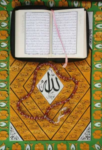 Directly Above Prints: Koran, rosary and Allah calligraphy, Paris, France, Europe