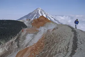 Fitness Prints: Koryaksky volcano seen beyond walkers on crater rim of Avacha volcano