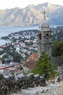 Kotor Prints: Kotor Old Town and fortifications at dawn with the Church of our Lady of Remedy in the foreground