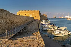 Watercraft Prints: Koules Venetian Fortress and boats at Heraklion port during sunset in Crete, Greece