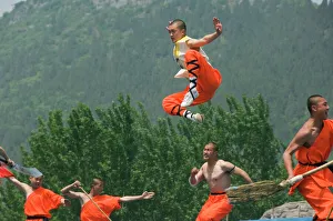Images Dated 10th January 2000: Kung fu students displaying their skills at a tourist show within Shaolin Temple
