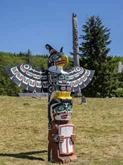 Indigenous Culture Prints: Kwakwaka wakw totem poles in the cemetery in Alert Bay, Cormorant Island