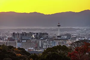 Nagoya Prints: Kyoto skyline at sunset with a vibrant orange sky, Kyoto Tower, Kyoto, Honshu, Japan, Asia