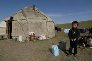 Kyrgyz boy in front of a yurt at Song Kol, Kyrgyzstan, Central Asia, Asia