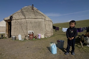 Images Dated 31st August 2009: Kyrgyz boy in front of a yurt at Song Kol, Kyrgyzstan, Central Asia, Asia