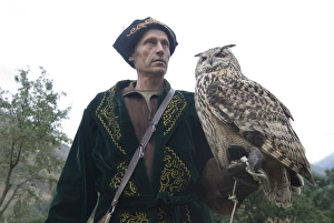 Images Dated 6th September 2009: Kyrgyz eagle hunter with a rock eagle-owl (Bubo bengalensis), Sunkar Eagle Farm