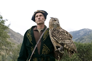 Images Dated 6th September 2009: Kyrgyz eagle hunter with a rock eagle-owl (Bubo bengalensis), Sunkar Eagle Farm