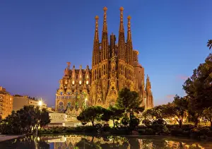 Basilica Prints: La Sagrada Familia church lit up at night designed by Antoni Gaudi