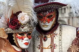 Typically Italian Gallery: Lady and gentleman in red and white masks, Venice Carnival, Venice, Veneto, Italy, Europe