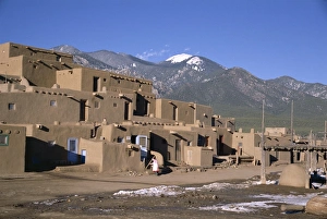 Adobe Prints: Lady sweeps up after visitors have departed