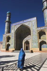 Veil Prints: Lady wearing a blue burqua outside the Friday Mosque (Masjet-e Jam), Herat