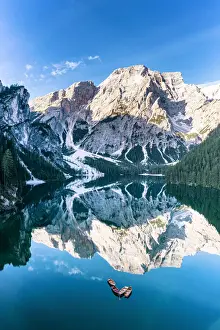 Lake Braies (Pragser Wildsee) with Croda del Becco reflected in water at dawn