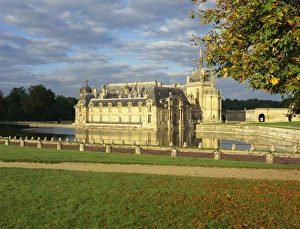 The lake and castle at Chantilly, in Picardie, France, Europe The lake and castle at Chantilly, in Picardie, France, Europe