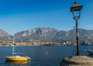 Lake Como Prints: Lake of Lecco, a branch of Lake Como in the southern Alps with the city of Lecco in the background