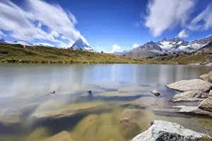 Mountain Peaks Prints: Lake Leisee frames the Matterhorn and the high peaks in the background in summer