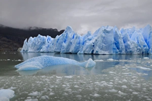 Blue Ice Prints: Lake-level view of blue ice at the glacier face and iceberg