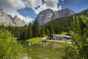 Lake near Hotel Lupo Bianco Wellness and Walking Canazei, Passo Pordoi with mountain backdrop