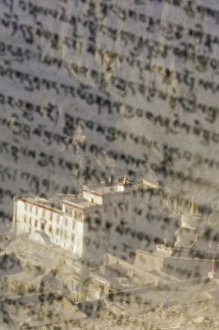 Lamayuru gompa (monastery) seen through prayer flag