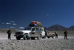 La Paz Prints: Landcruisers and tourists on jeep tour taking a break on Uyuni salt flat