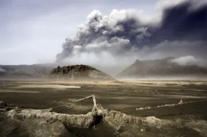 Dust Gallery: Landscape covered in volcanic ash and dust with the ash plume of the Eyjafjallajokull eruption in