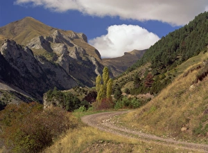 Rural Road Prints: Landscape of rough road through the mountains near Bielsa
