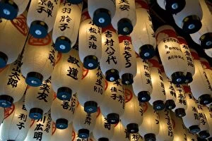 Lanterns with donors names hanging from the ceiling at Hozenji Temple in Namba