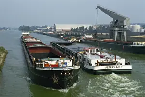 Water Way Prints: Large barges pass on busy canal near the Netherlands border