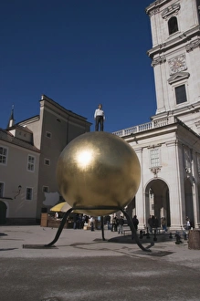 Large golden ball in Kapitelplatz, Salzburg, Austria, Europe