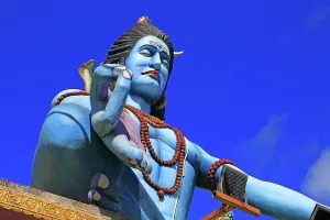Identity Prints: Large statue of Lord Shiva stands against blue sky in a Hindu temple in Mauritius