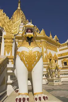 Guardian Prints: Large white and gold statues of a chinthe stand guard at Swedawmyat Paya