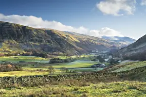 Late afternoon winter sunlight over Threlkeld Knotts from Tewet Tarn, St